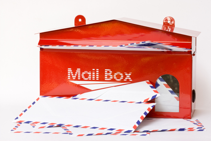 Red mail box with letters in front of it - Campaign Mailers